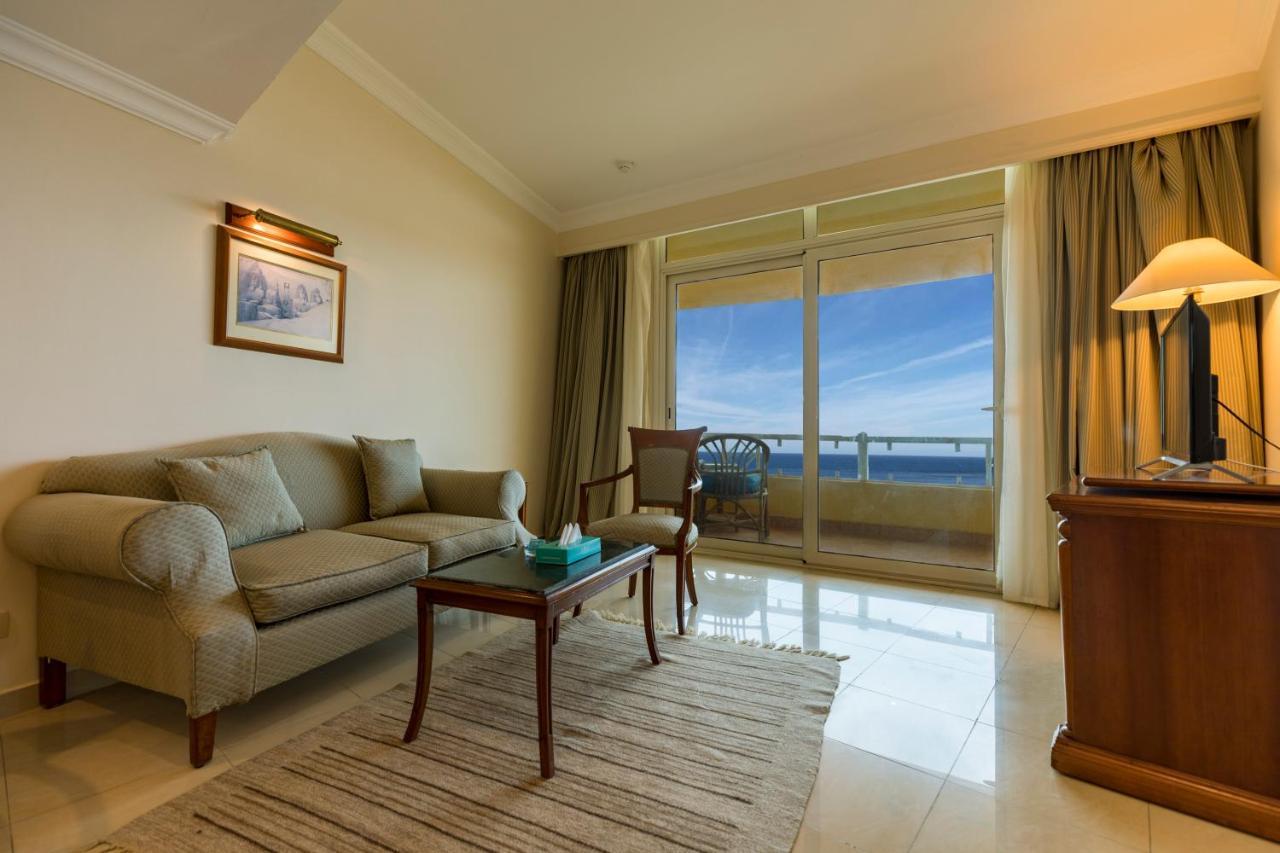 Sunrise Alex Avenue Hotel Alexandria Exterior photo A living room in a suite at the Taj Bengal